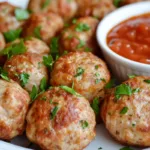 Juicy turkey meatballs served with marinara sauce and herbs